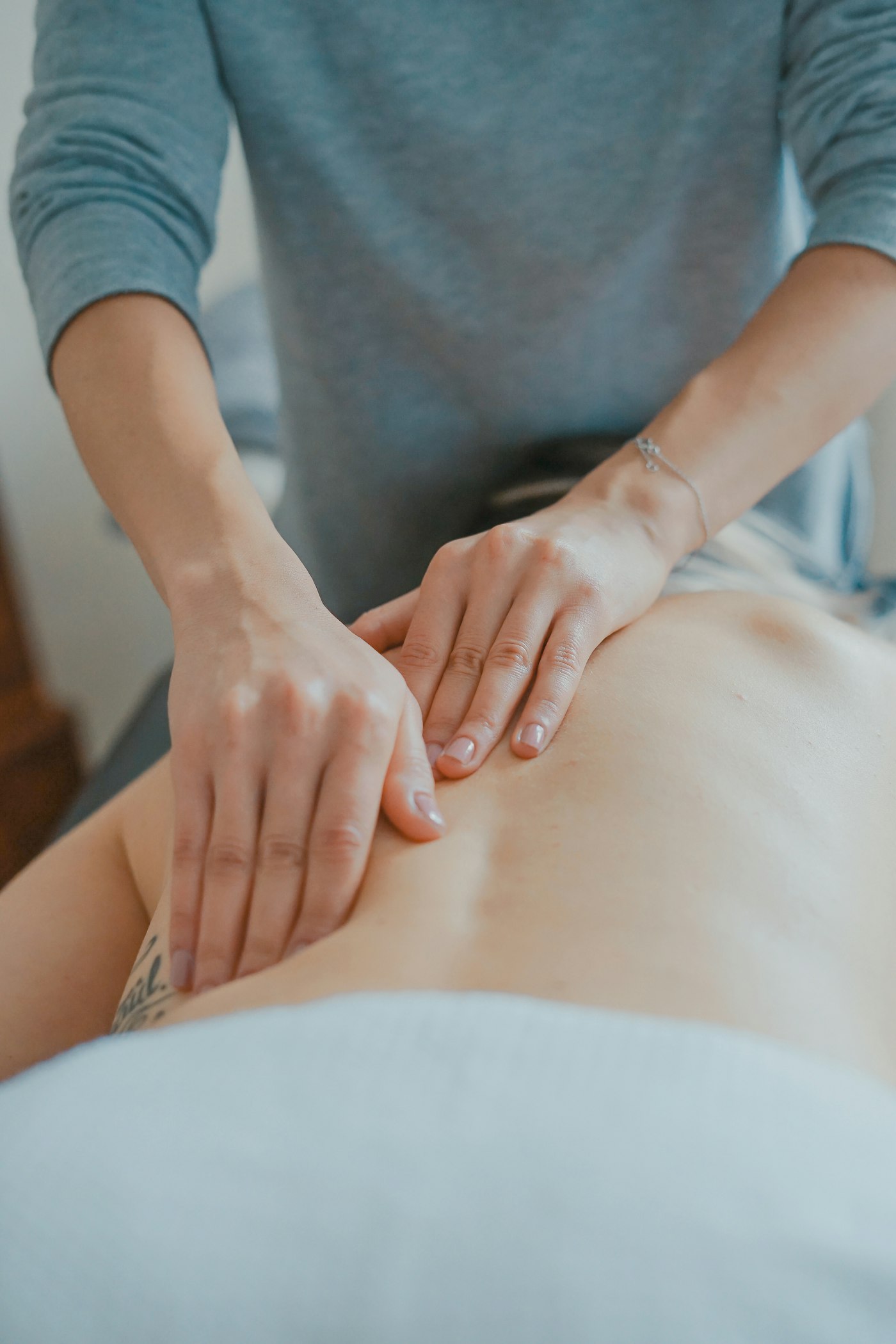 Deep tissue massage pressure on back